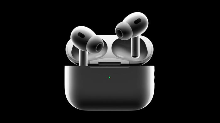 Black Apple AirPods floating above their charging case