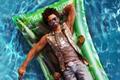 The character lying in a pool in Dead Island 2.